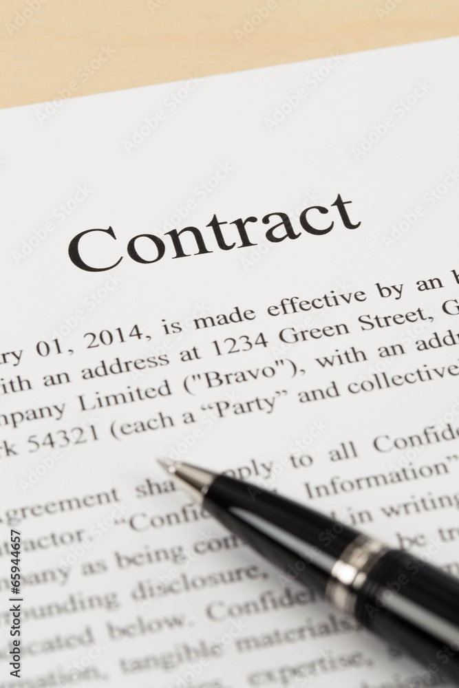 Business contract document with pen close-up Business contract document with pen close-up