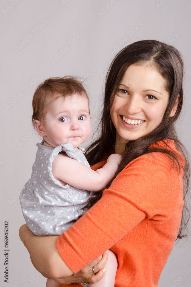 Young mother hugging her daughter Young mother hugging her daughter