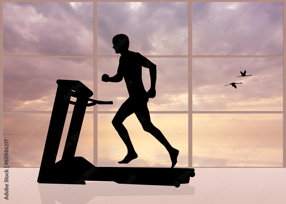 man runs on a treadmill