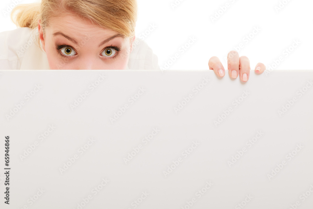 Businesswoman hiding behind blank copy space banner Businesswoman hiding behind blank copy space banner