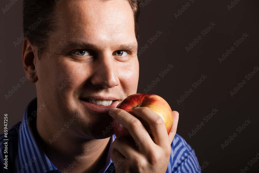 Diet nutrition. Happy man holding apple fruit Diet nutrition. Happy man holding apple fruit