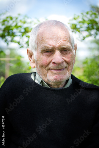 80 plus year old senior man posing for a portrait