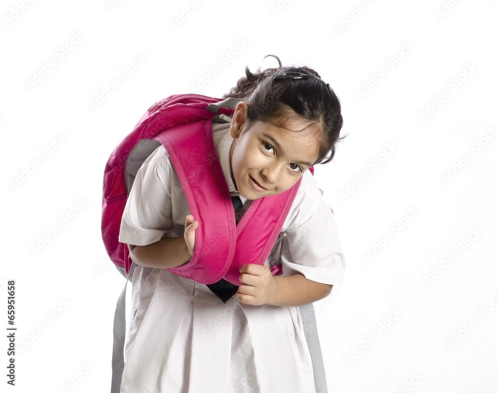 A little girl tired of lifting heavy bag A little girl tired of lifting heavy bag