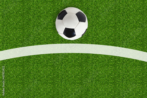 Soccer ball on green field grass © wolfelarry