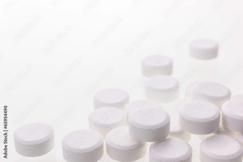 White pills isolated over white. White pills isolated over white.