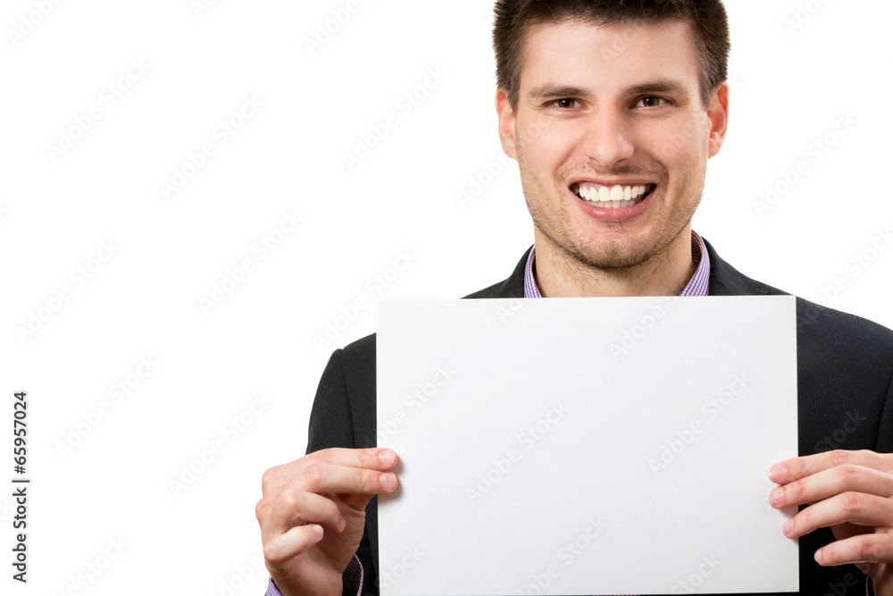 Smiling young business man,showing a white card. Smiling young business man,showing a white card.