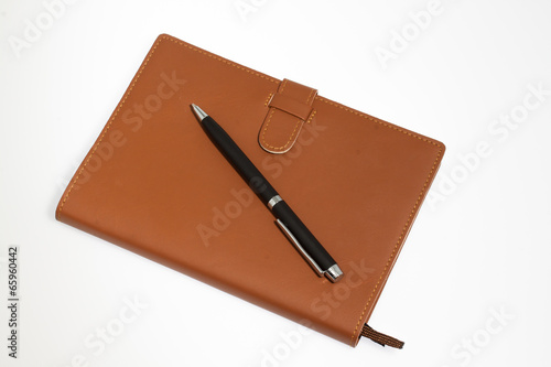 notebook with pen