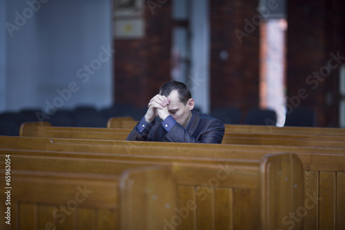 Man praying in church