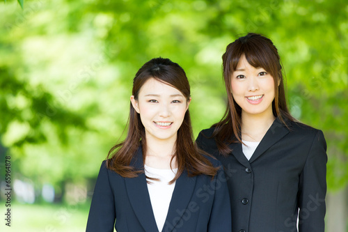 asian businesswomen on green background
