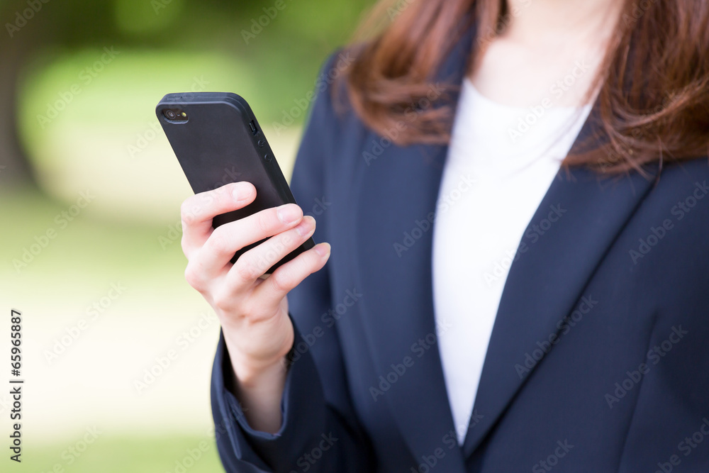 asian businesswoman using smart phone