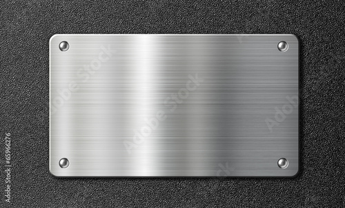 stainless steel metal plate over black texture