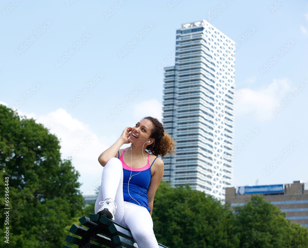 Happy young woman listening to music