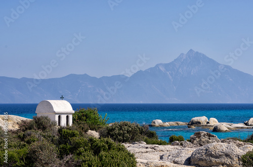 Little church on a rock overlooking the sea  in Greece