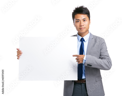Business man hold with blank board © leungchopan