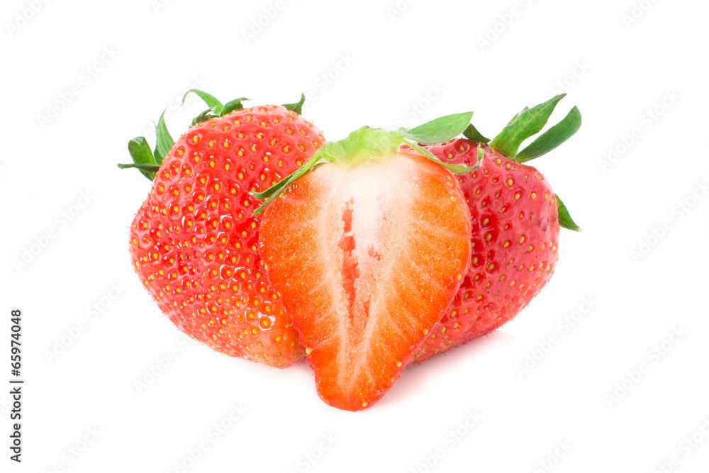 Three fresh strawberries and a slice Three fresh strawberries and a slice