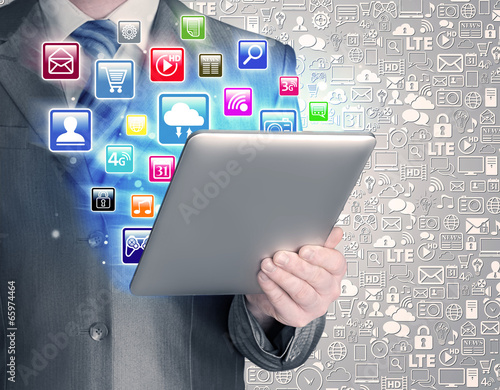 Business man use tablet pc with colorful application icons