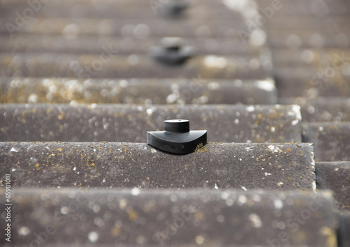 Screw protection stud on asbestos roof