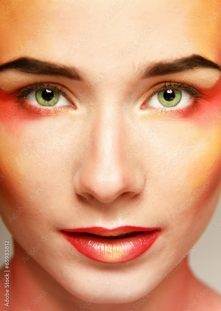 beautiful make up of bright lips, isolated on grey background beautiful make up of bright lips, isolated on grey background