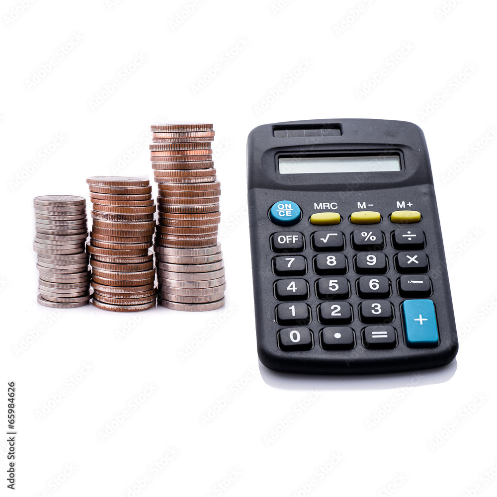 Coins and calculator on white background Coins and calculator on white background