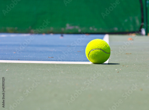 Tennis Ball on the Court © torsak