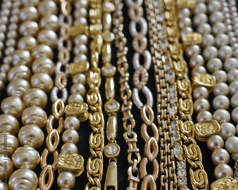 pirate's gold, variety of precious jewelry closeup, strong bokeh pirate's gold, variety of precious jewelry closeup, strong bokeh