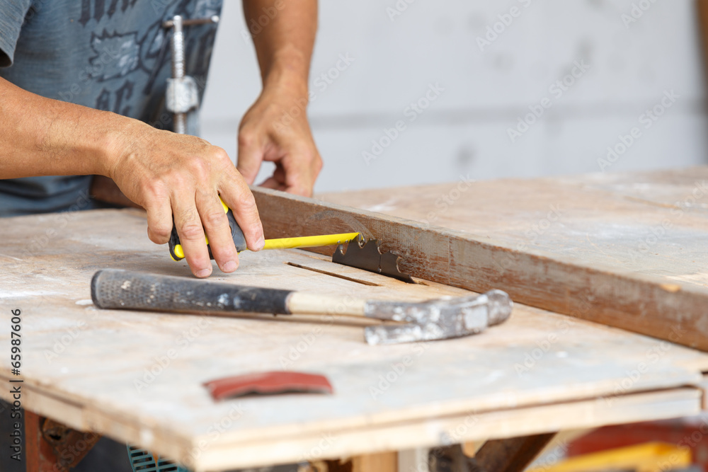carpenter cut wood for house construction carpenter cut wood for house construction