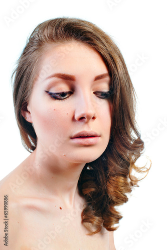 Portrait of a beautiful young woman with evening make-up