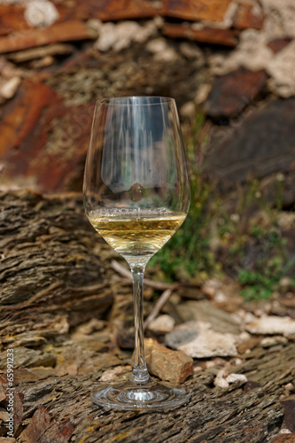 Glass of Riesling wine on slate rock