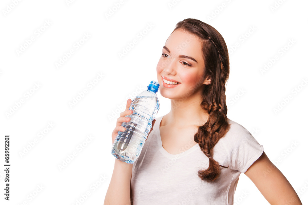 Beautiful woman drinking water from blue bottle Beautiful woman drinking water from blue bottle