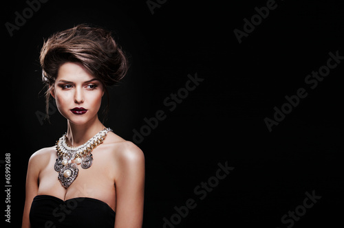 beautiful woman with perfect makeup wearing jewelry