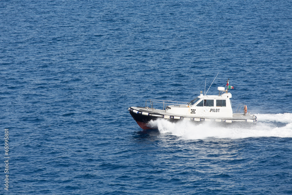 Pilot Boat Cutting Across Blue Water Pilot Boat Cutting Across Blue Water