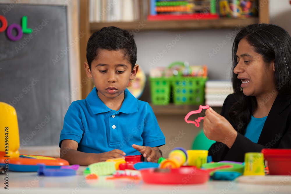 Hispanic Mom with Child in Home School Setting Working on Crafts Hispanic Mom with Child in Home School Setting Working on Crafts
