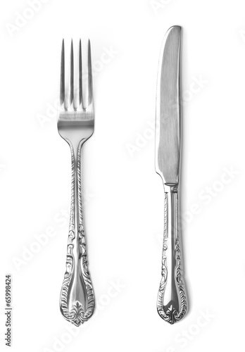 Vintage knife and fork on white background
