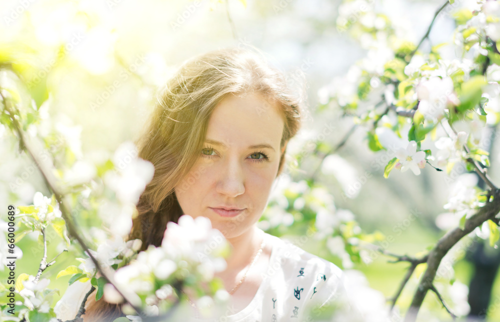 beautiful young brunette woman standing near the apple tree on a beautiful young brunette woman standing near the apple tree on a