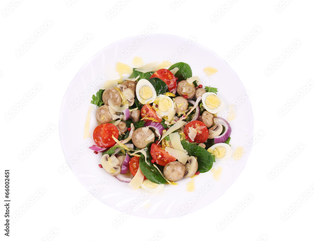 Mushroom salad with tomatoes and quail eggs.