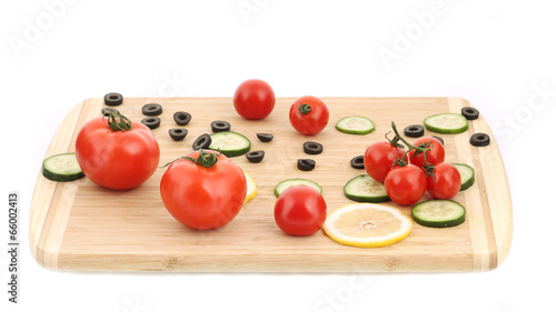 Vegetable composition on cutting board.