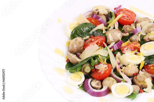 Mushroom salad with tomatoes and quail eggs.