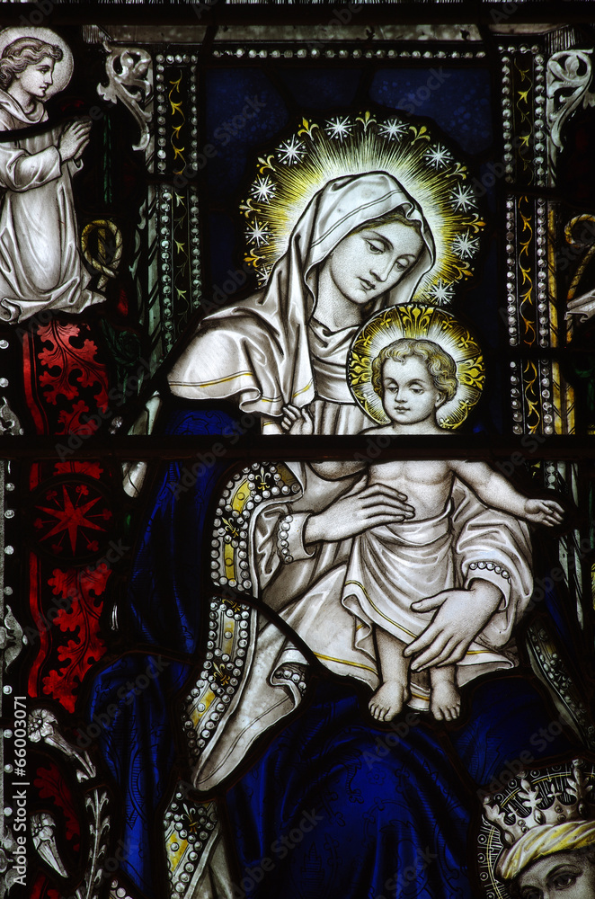 Mary holding her son Jesus in stained glass