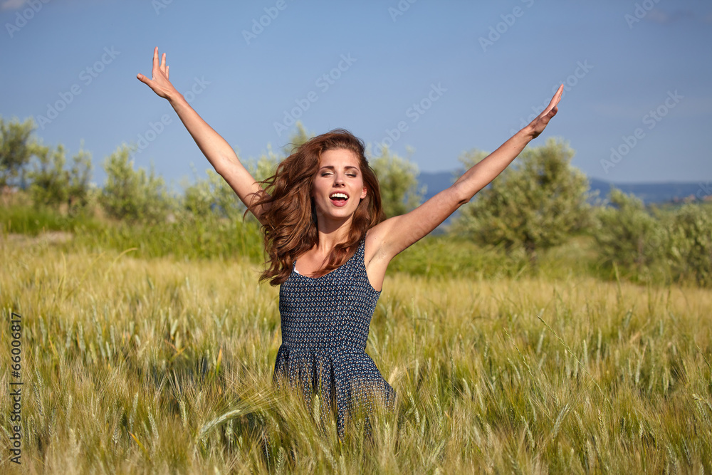 Woman in wheat field enjoying, freedom concept Woman in wheat field enjoying, freedom concept