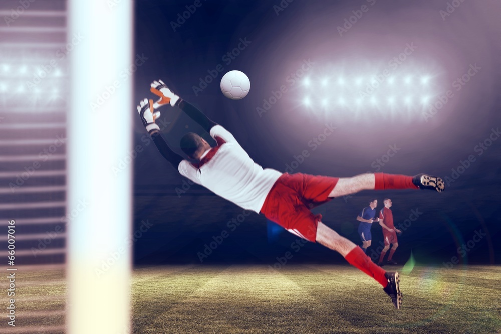 Composite image of fit goal keeper jumping up Composite image of fit goal keeper jumping up