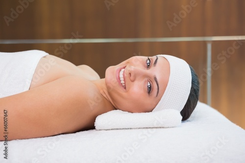 Peaceful brunette lying on massage table