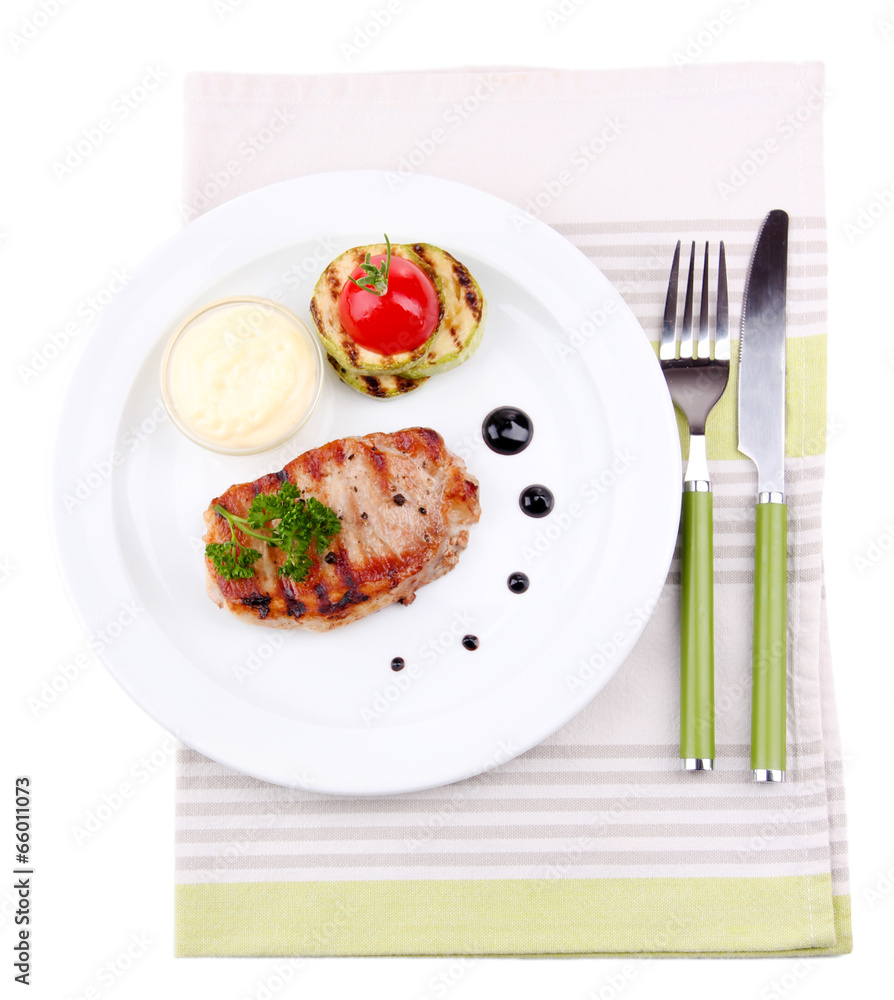 Grilled steak and grilled vegetables on plate, isolated on Grilled steak and grilled vegetables on plate, isolated on
