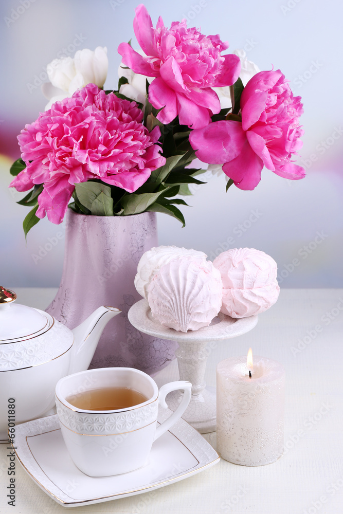 Composition of beautiful peonies in vase, tea in cup and Composition of beautiful peonies in vase, tea in cup and