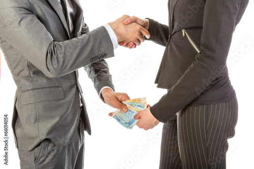 Man gives woman money while shaking hands