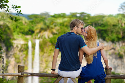Young couple enjoying a view on Chamarel falls © MNStudio
