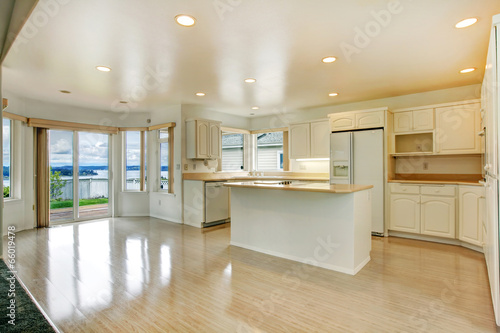 House interior. Empty white kitchen room with walkout deck