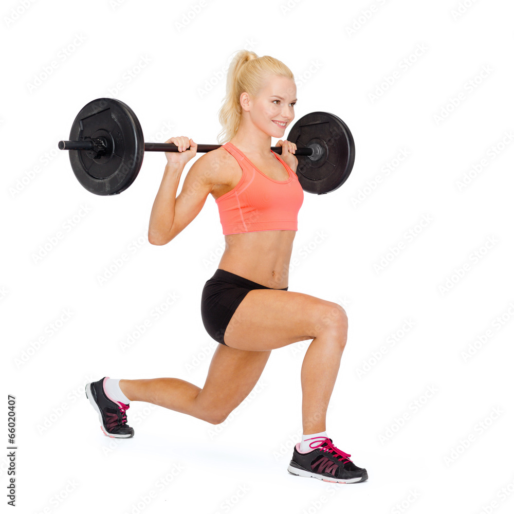 smiling sporty woman exercising with barbell smiling sporty woman exercising with barbell