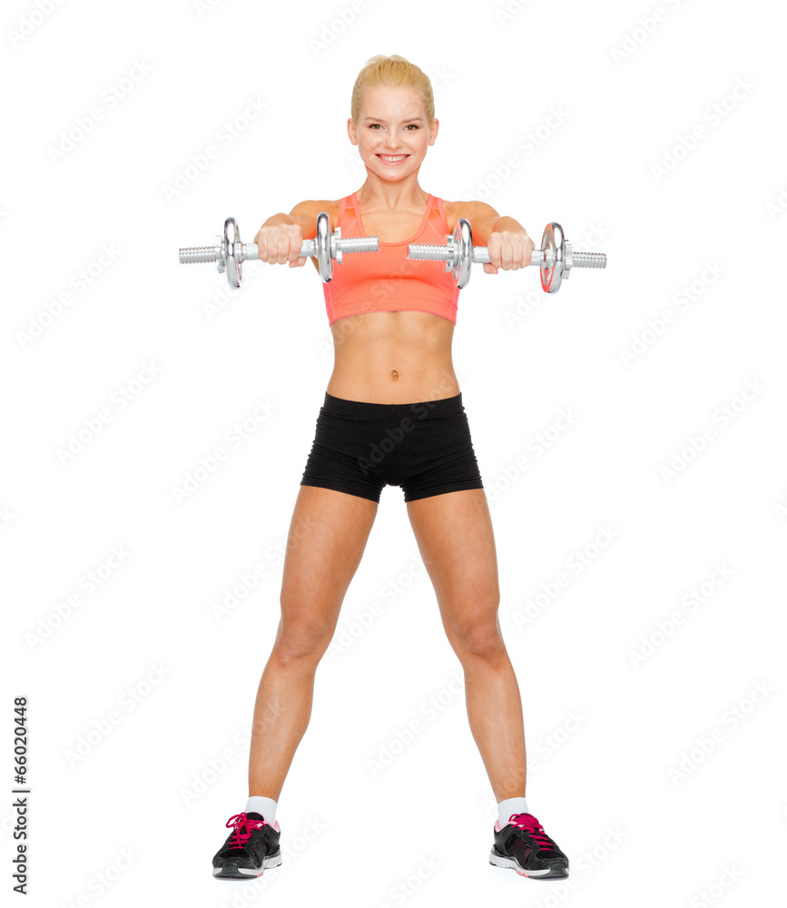 smiling sporty woman with heavy steel dumbbells smiling sporty woman with heavy steel dumbbells