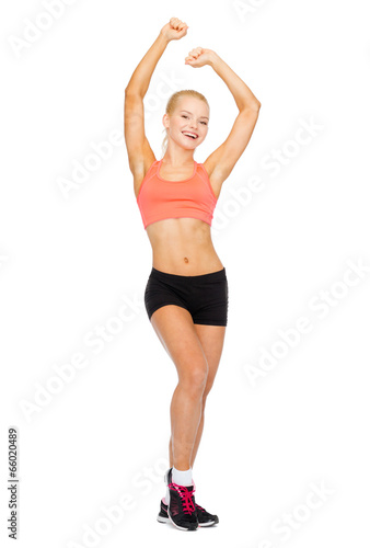 beautiful sporty woman dancing