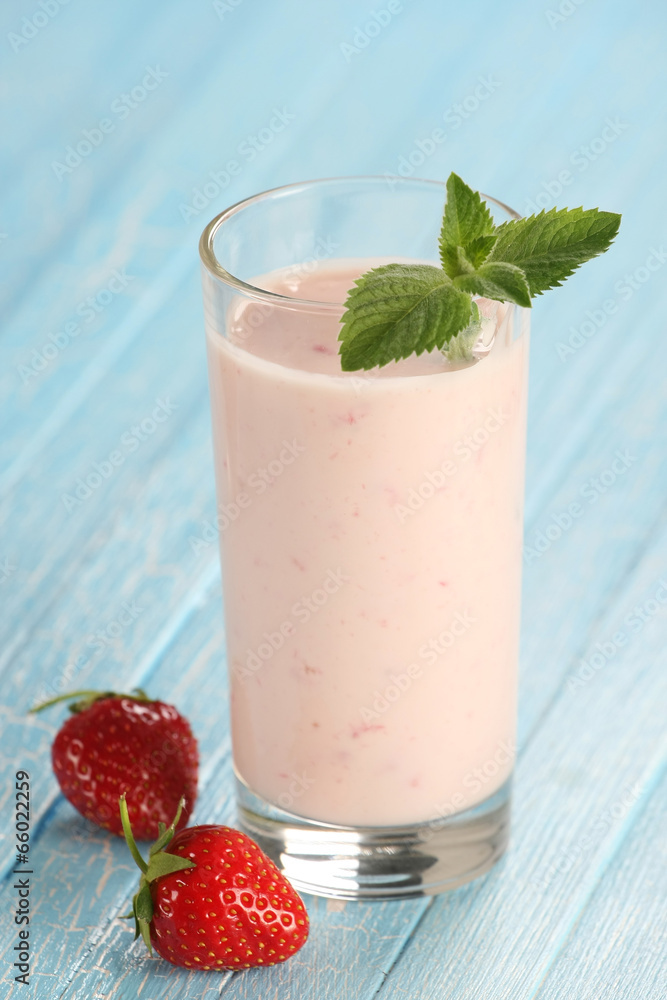 strawberry with yogurt in a glass on a wooden background strawberry with yogurt in a glass on a wooden background